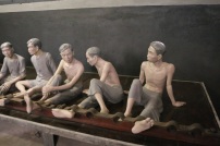 The wax prisoner figures demonstrated how they held them by ankle shackles.